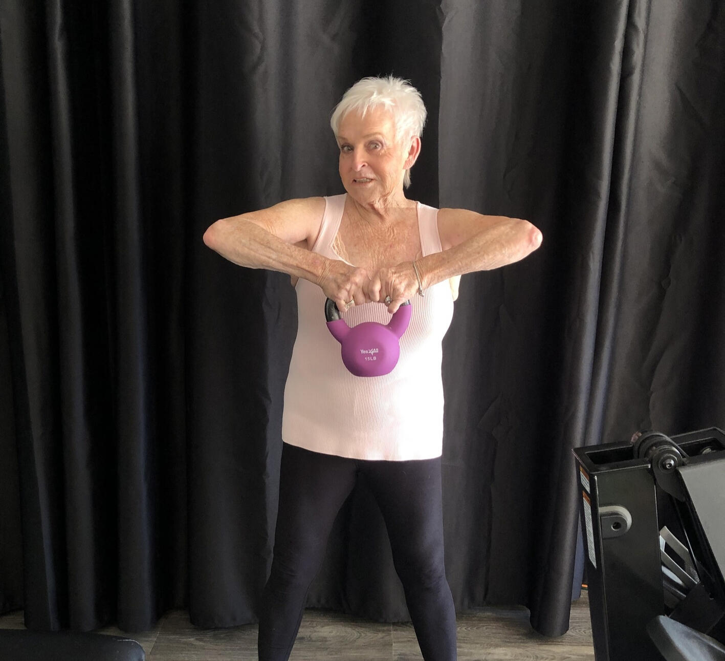 Older woman exercising with kettlebell